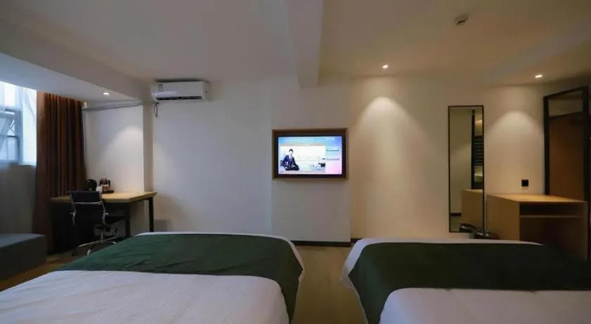 Bed in Green Tree Inn Guangxi Wuzhou 2nd Xinxing Road Liangguang Market