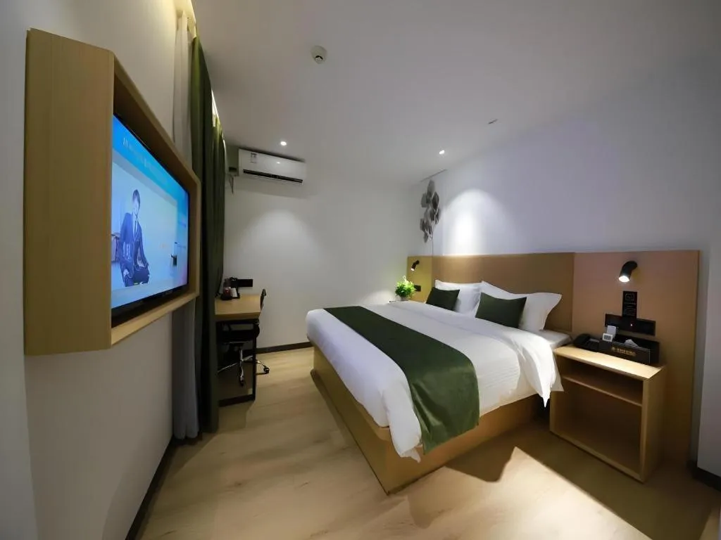 Bed in Green Tree Inn Guangxi Wuzhou 2nd Xinxing Road Liangguang Market