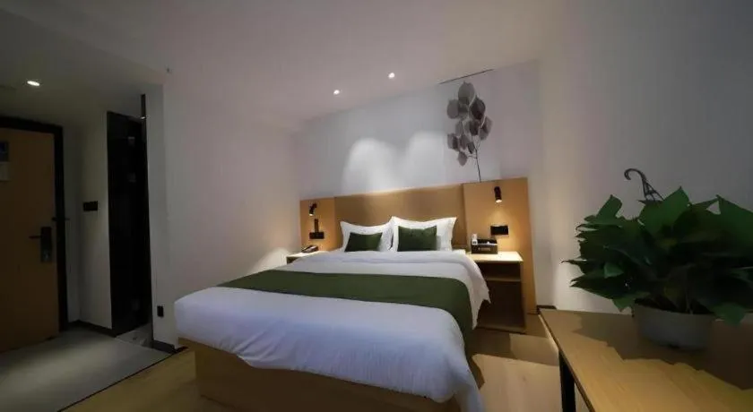 Bed in Green Tree Inn Guangxi Wuzhou 2nd Xinxing Road Liangguang Market
