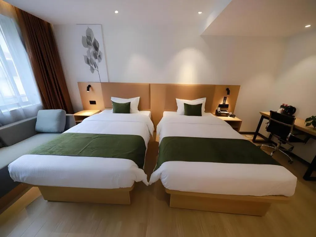 Bed in Green Tree Inn Guangxi Wuzhou 2nd Xinxing Road Liangguang Market