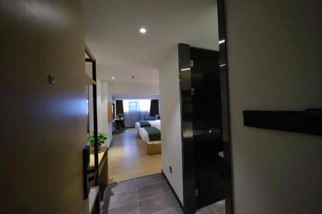 Bed in Green Tree Inn Guangxi Wuzhou 2nd Xinxing Road Liangguang Market