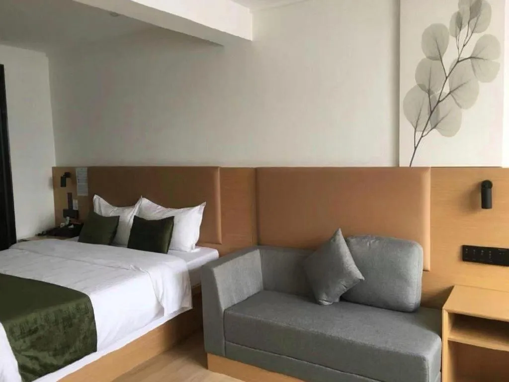 Bed in Green Tree Inn Guangxi Wuzhou 2nd Xinxing Road Liangguang Market