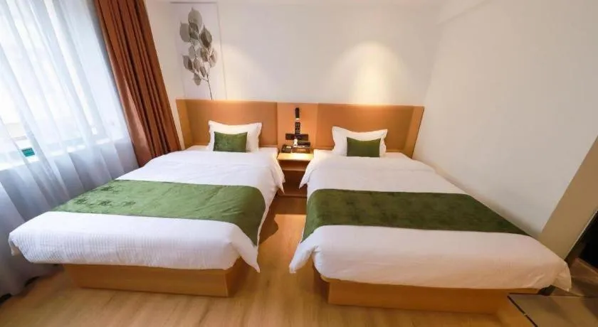 Bed in Green Tree Inn Guangxi Wuzhou 2nd Xinxing Road Liangguang Market