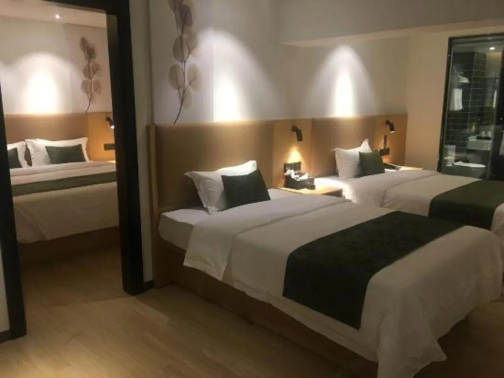 Bed in Green Tree Inn Guangxi Wuzhou 2nd Xinxing Road Liangguang Market