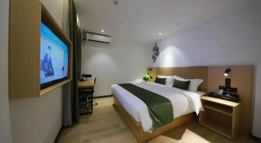 Bed in Green Tree Inn Guangxi Wuzhou 2nd Xinxing Road Liangguang Market