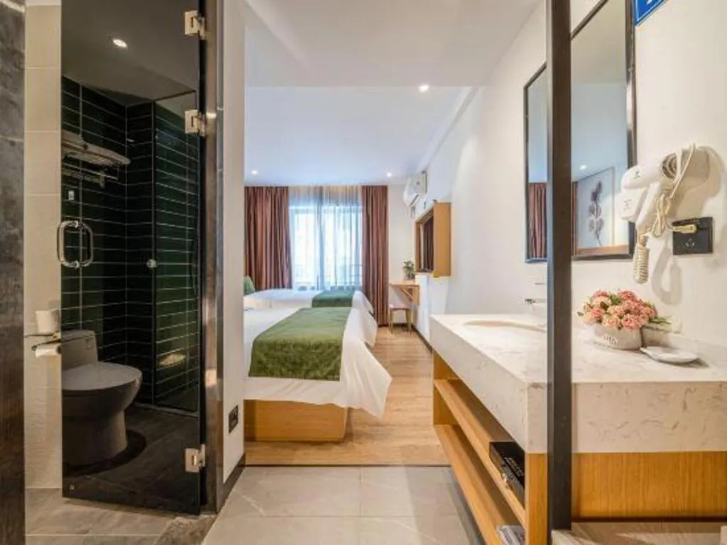 Bed in Green Tree Inn Guangxi Wuzhou 2nd Xinxing Road Liangguang Market