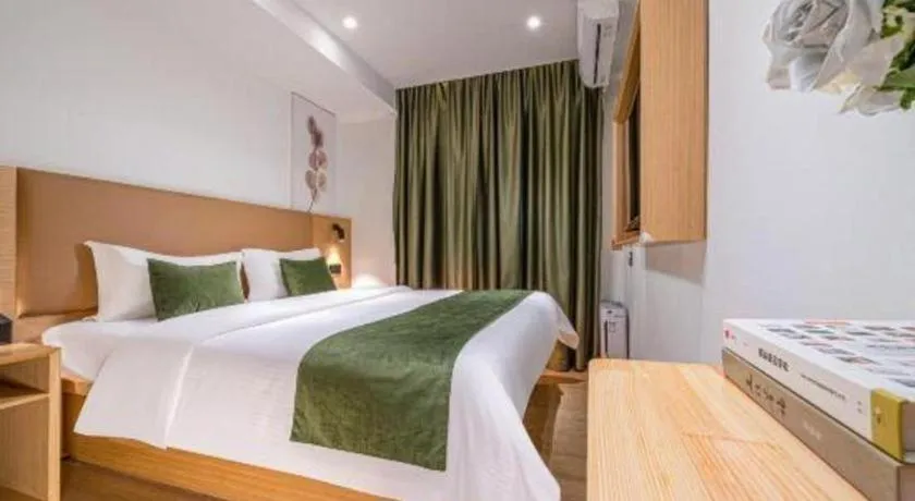 Bed in Green Tree Inn Guangxi Wuzhou 2nd Xinxing Road Liangguang Market