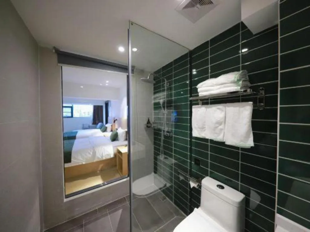 Bed in Green Tree Inn Guangxi Wuzhou 2nd Xinxing Road Liangguang Market