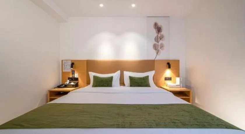 Bed in Green Tree Inn Guangxi Wuzhou 2nd Xinxing Road Liangguang Market