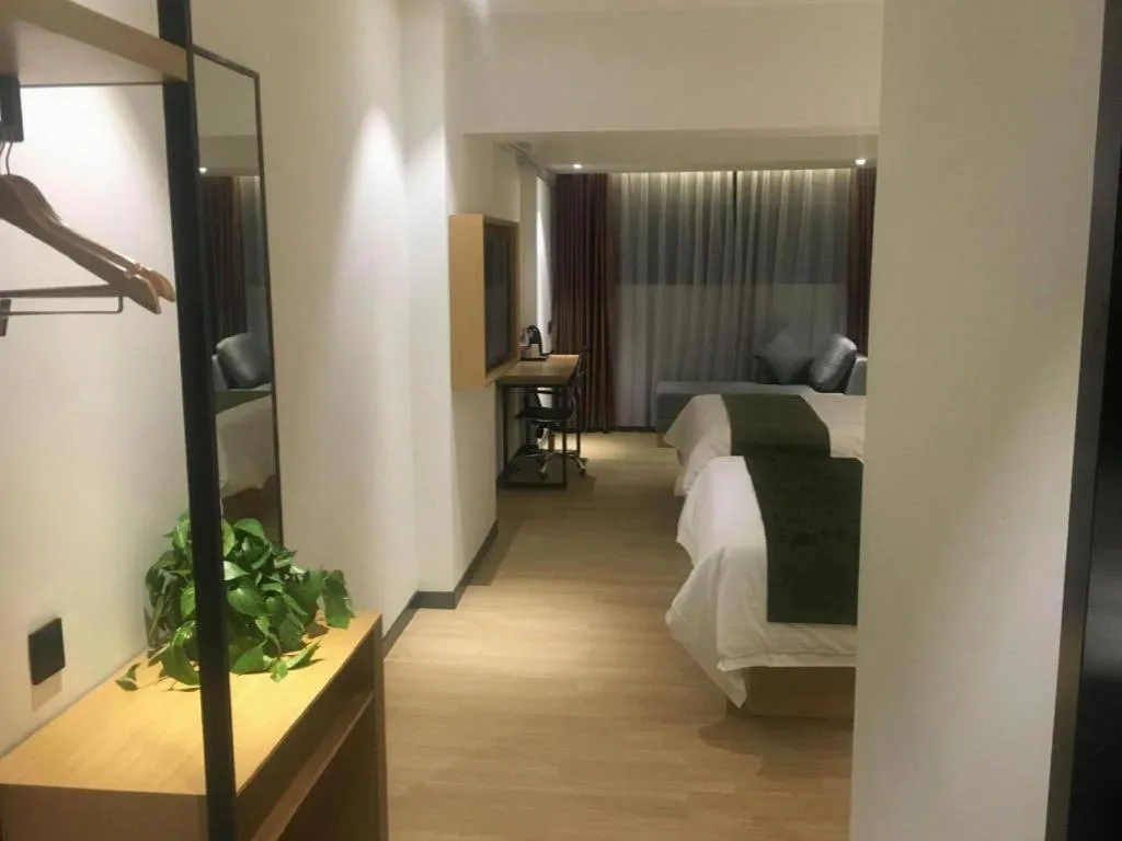 Bed in Green Tree Inn Guangxi Wuzhou 2nd Xinxing Road Liangguang Market