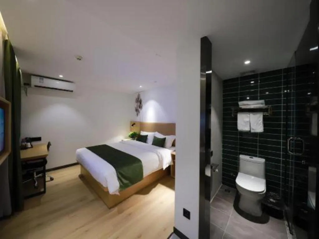 Bed in Green Tree Inn Guangxi Wuzhou 2nd Xinxing Road Liangguang Market