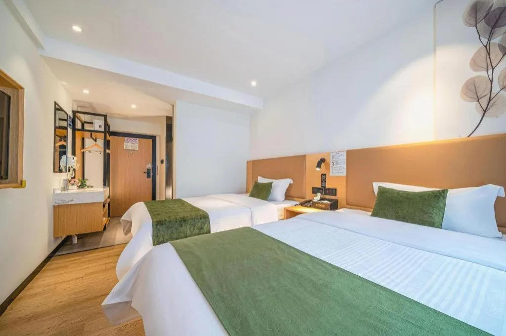 Bed in Green Tree Inn Guangxi Wuzhou 2nd Xinxing Road Liangguang Market
