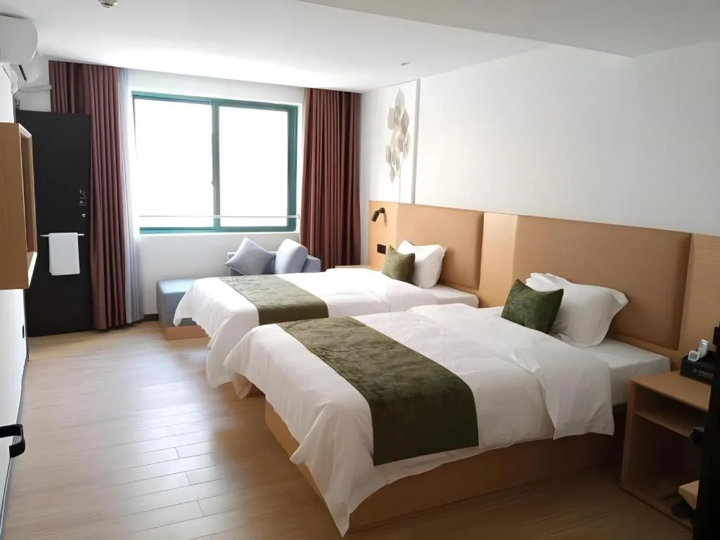 Bed in Green Tree Inn Guangxi Wuzhou 2nd Xinxing Road Liangguang Market