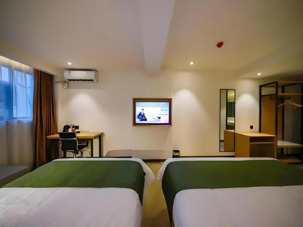 Bed in Green Tree Inn Guangxi Wuzhou 2nd Xinxing Road Liangguang Market
