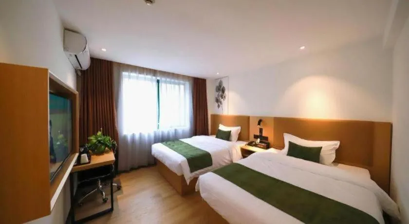 Bed in Green Tree Inn Guangxi Wuzhou 2nd Xinxing Road Liangguang Market