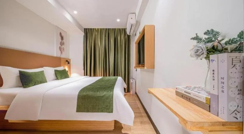Bed in Green Tree Inn Guangxi Wuzhou 2nd Xinxing Road Liangguang Market