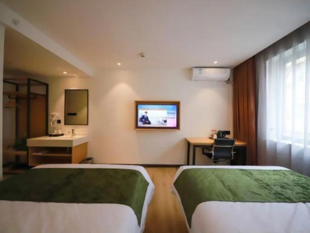 Bed in Green Tree Inn Guangxi Wuzhou 2nd Xinxing Road Liangguang Market