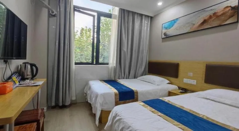 Bed in Shell Hotel Shanghai Normal University Hongcao Road Metro Station Guiping Road