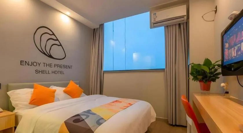 Bed in Shell Hotel Suzhou Zhangjiagang Jingang Town Central Plaza