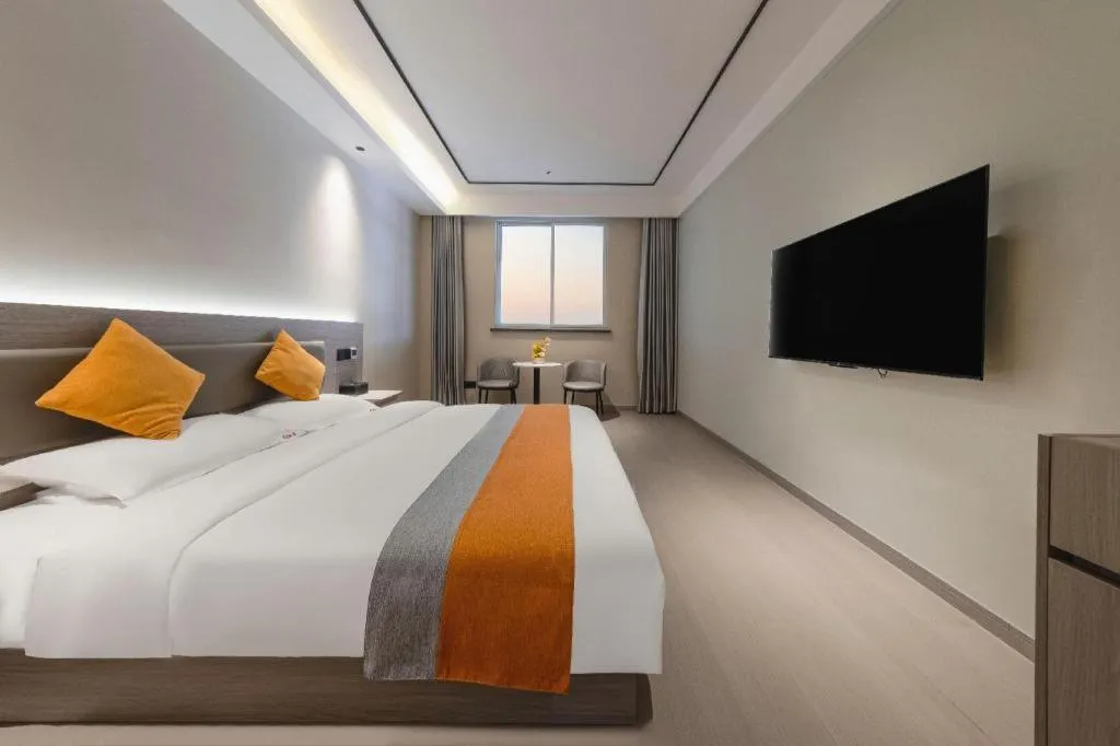 Bed in Shell Hotel Suzhou Zhangjiagang Jingang Town Central Plaza