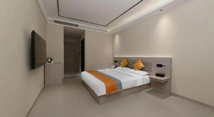 Bed in Shell Hotel Suzhou Zhangjiagang Jingang Town Central Plaza