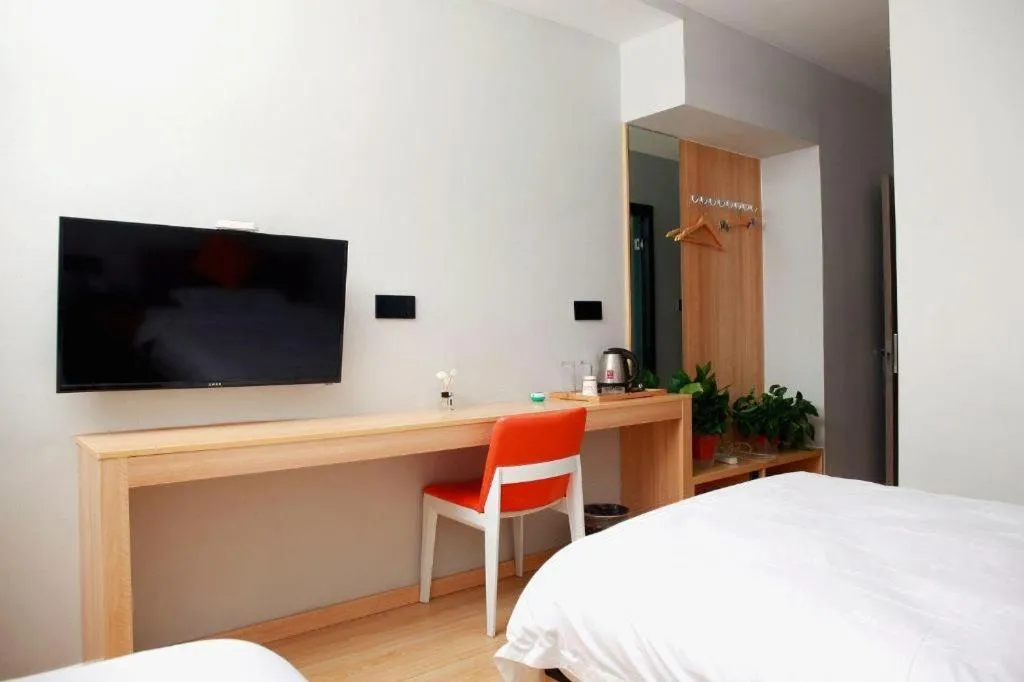 Bed in Shell Hotel Suzhou Zhangjiagang Jingang Town Central Plaza