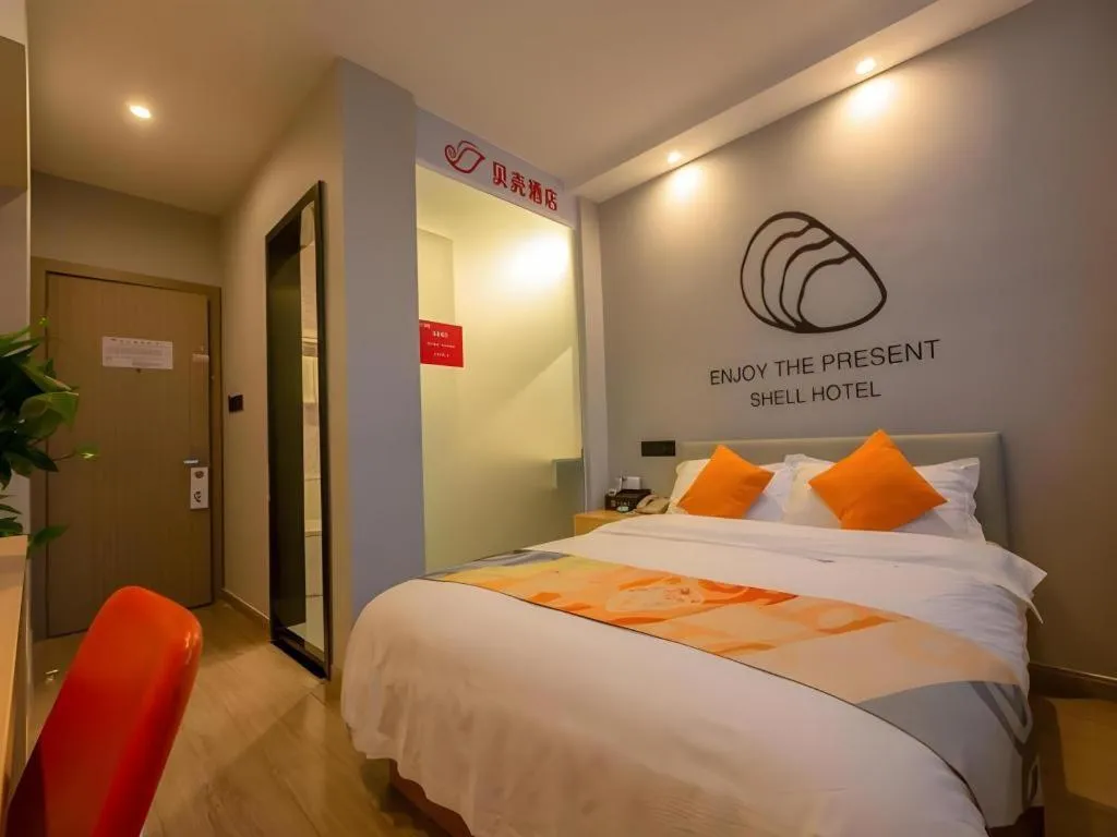 Bed in Shell Hotel Suzhou Zhangjiagang Jingang Town Central Plaza