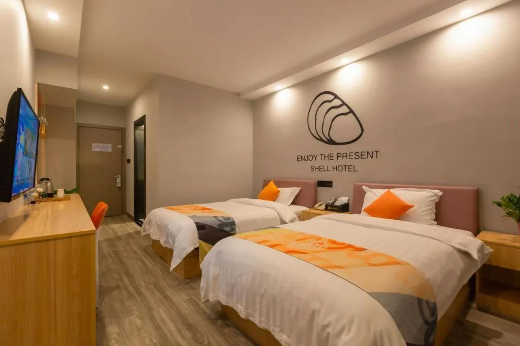 Bed in Shell Hotel Suzhou Zhangjiagang Jingang Town Central Plaza