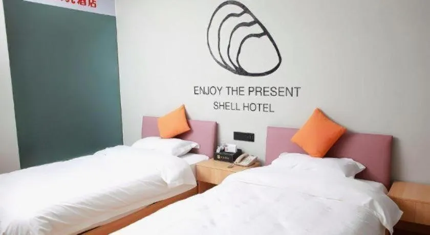 Bed in Shell Hotel Suzhou Zhangjiagang Jingang Town Central Plaza