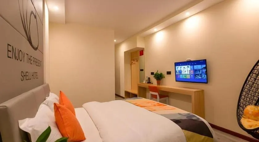 Bed in Shell Hotel Suzhou Zhangjiagang Jingang Town Central Plaza