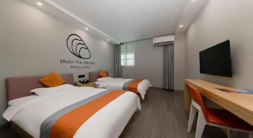 Bed in Shell Hotel Suzhou Zhangjiagang Jingang Town Central Plaza