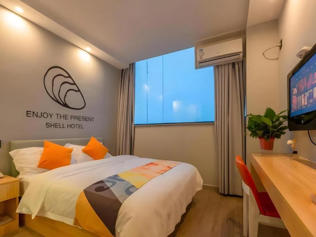 Bed in Shell Hotel Suzhou Zhangjiagang Jingang Town Central Plaza