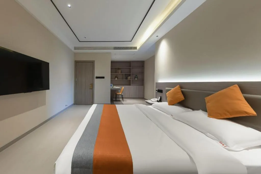 Bed in Shell Hotel Suzhou Zhangjiagang Jingang Town Central Plaza