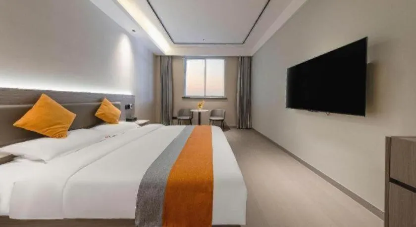 Bed in Shell Hotel Suzhou Zhangjiagang Jingang Town Central Plaza