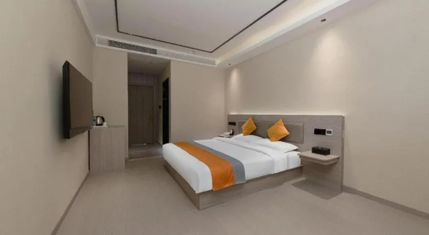 Bed in Shell Hotel Suzhou Zhangjiagang Jingang Town Central Plaza