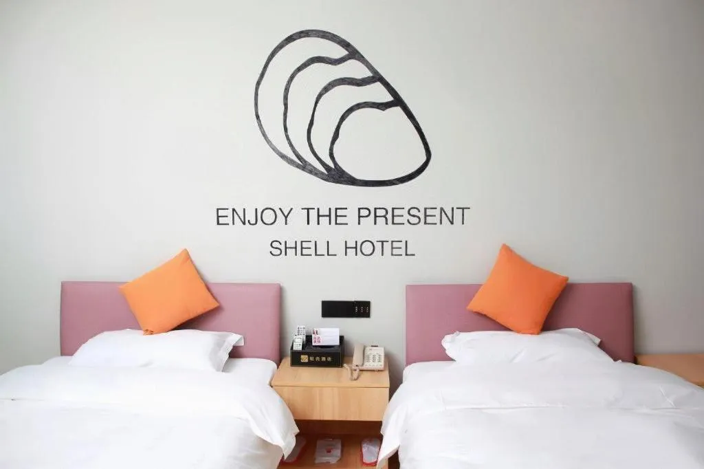 Bed in Shell Hotel Suzhou Zhangjiagang Jingang Town Central Plaza