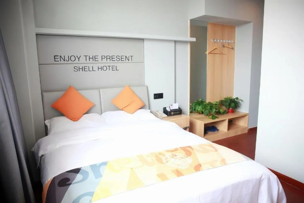 Bed in Shell Hotel Suzhou Zhangjiagang Jingang Town Central Plaza