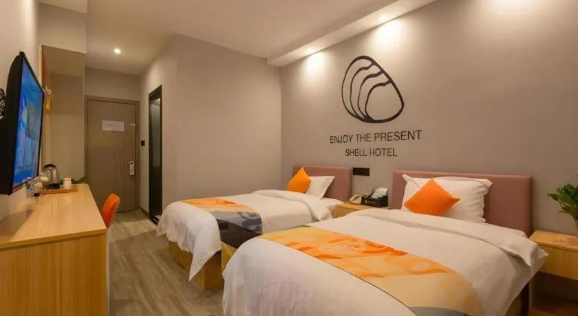 Bed in Shell Hotel Suzhou Zhangjiagang Jingang Town Central Plaza