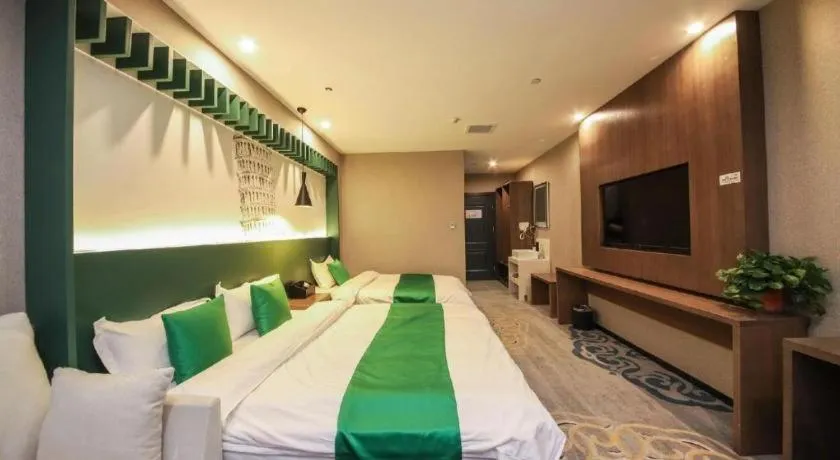 Bed in Shell Hotel Zhengzhou East High-Speed Railway Station Zhengdong Commerical Center