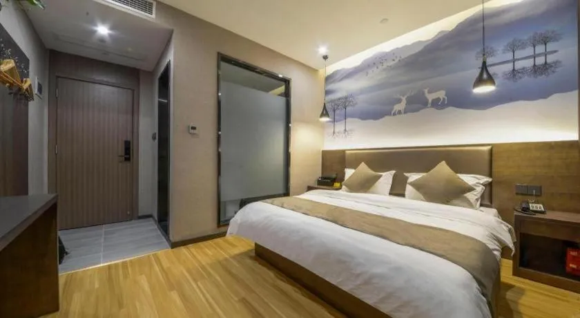 Bed in Shell Hotel Zhengzhou East High-Speed Railway Station Zhengdong Commerical Center