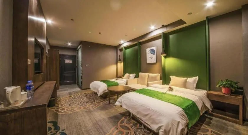 Bed in Shell Hotel Zhengzhou East High-Speed Railway Station Zhengdong Commerical Center