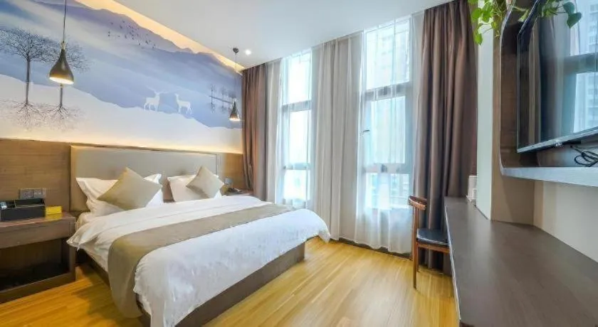 Bed in Shell Hotel Zhengzhou East High-Speed Railway Station Zhengdong Commerical Center