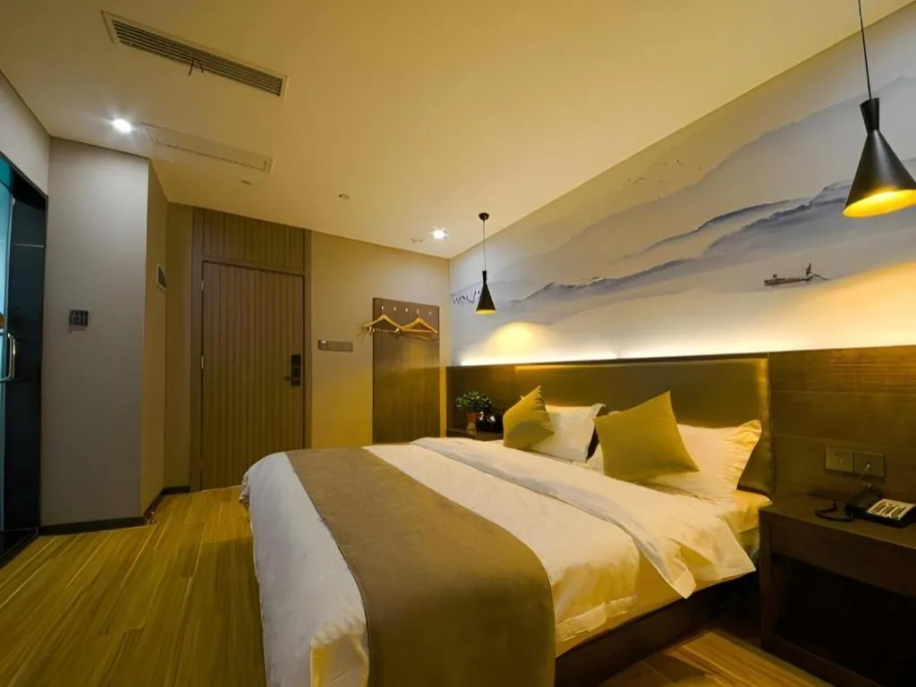 Bed in Shell Hotel Zhengzhou East High-Speed Railway Station Zhengdong Commerical Center