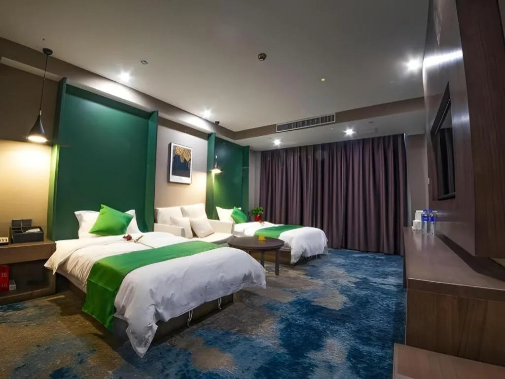 Bed in Shell Hotel Zhengzhou East High-Speed Railway Station Zhengdong Commerical Center