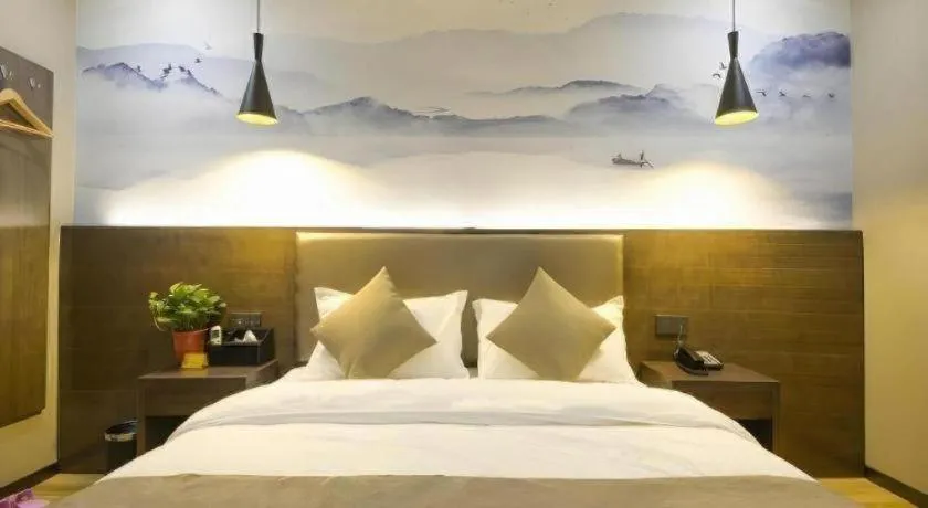 Bed in Shell Hotel Zhengzhou East High-Speed Railway Station Zhengdong Commerical Center