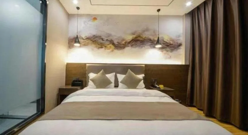 Bed in Shell Hotel Zhengzhou East High-Speed Railway Station Zhengdong Commerical Center