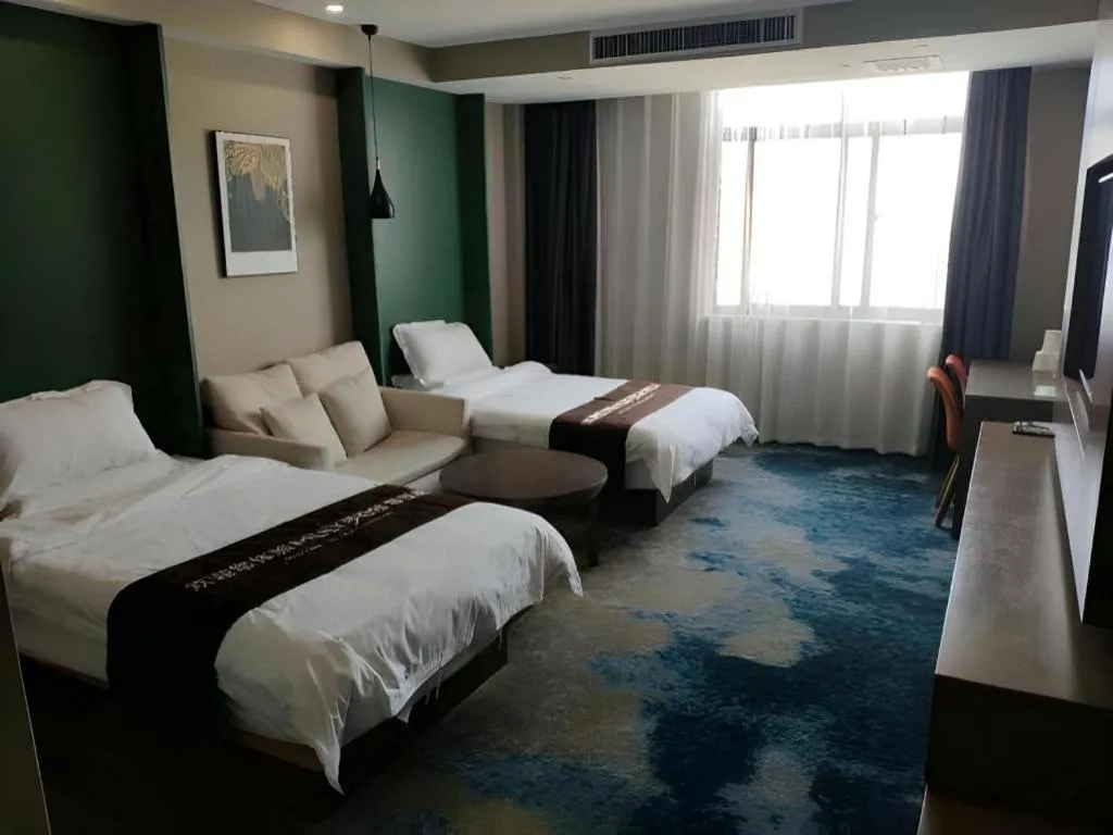 Bed in Shell Hotel Zhengzhou East High-Speed Railway Station Zhengdong Commerical Center