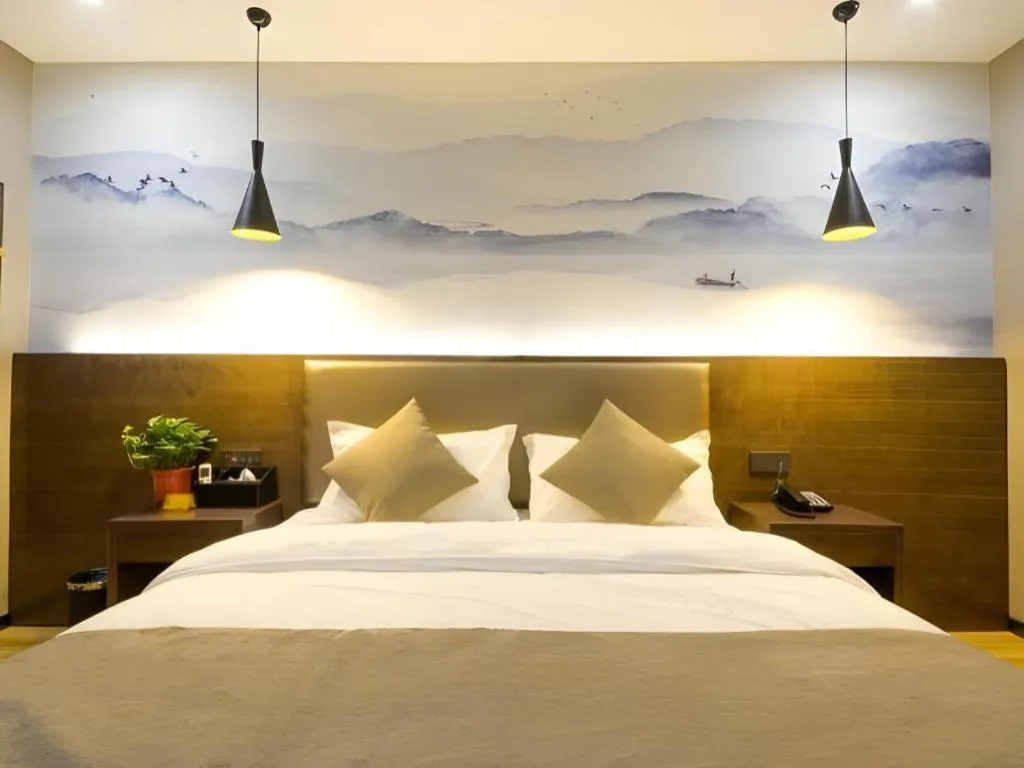 Bed in Shell Hotel Zhengzhou East High-Speed Railway Station Zhengdong Commerical Center