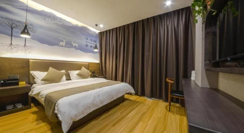 Bed in Shell Hotel Zhengzhou East High-Speed Railway Station Zhengdong Commerical Center