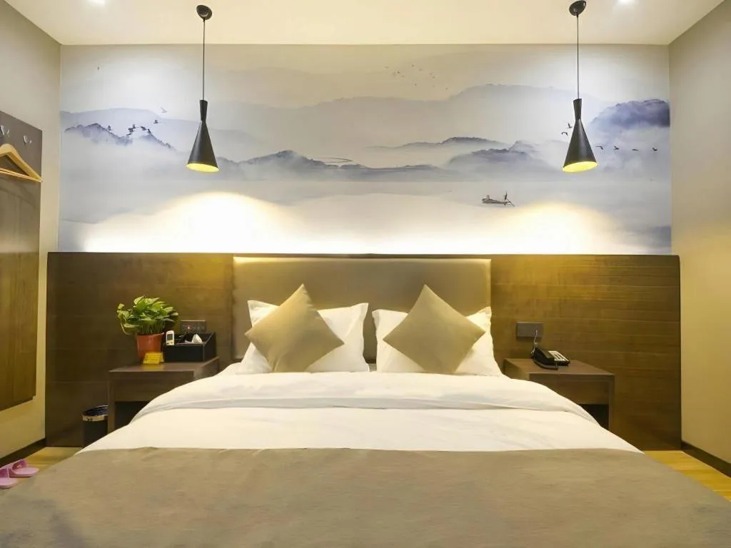 Bed in Shell Hotel Zhengzhou East High-Speed Railway Station Zhengdong Commerical Center